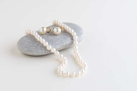 box is tied with a necklace of pearls. Copy space.Holiday conceptの写真素材