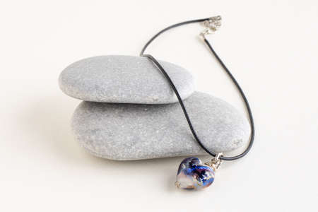 Heart on pendant gray stones.の写真素材