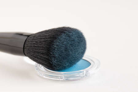 Make-up brush with blue eye shadowsの写真素材