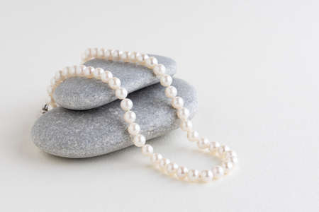 box is tied with a necklace of pearls. Copy space.Holiday conceptの写真素材