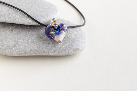 Heart on pendant gray stones.の写真素材