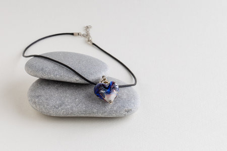 Heart on pendant gray stones.の写真素材