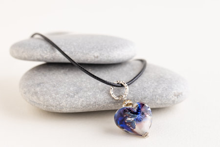 Heart on pendant gray stones.の写真素材
