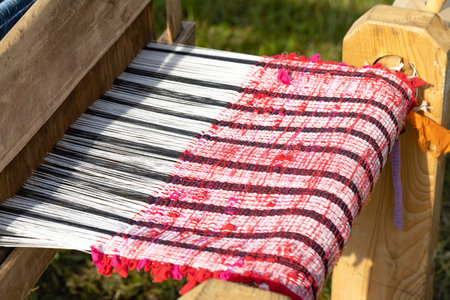 carpet loom parts on green grassの写真素材