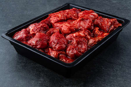 Raw pieces of meat shish kebab in marinade with pepper, onion, ready to cook, barbecue meatの写真素材