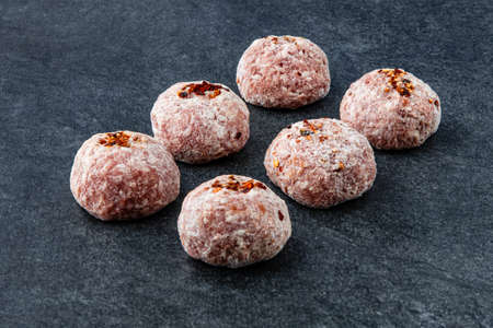 Frozen meat dumplings on gray stone backgroundの写真素材