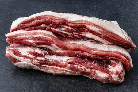 Piece of fresh raw pork from the neck set, without any ingredients or decorationの写真素材
