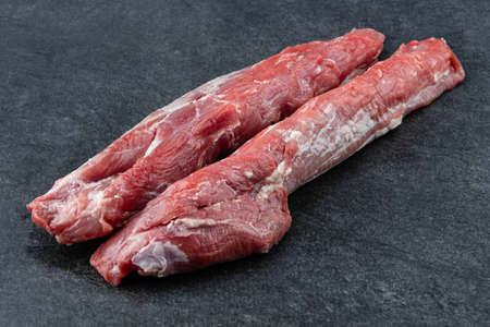Piece of fresh raw pork from the neck set, without any ingredients or decorationの写真素材