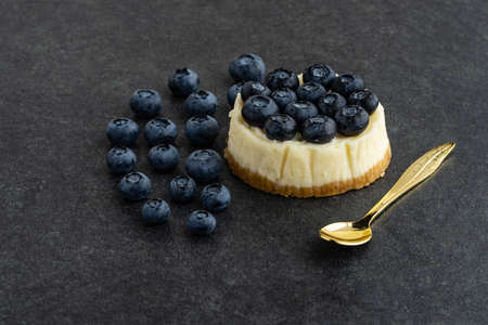 Blueberry cheesecake on stone backgroundの写真素材