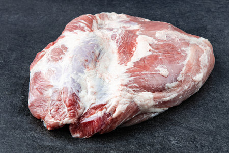 Piece of fresh raw pork from the neck set, without any ingredients or decorationの写真素材
