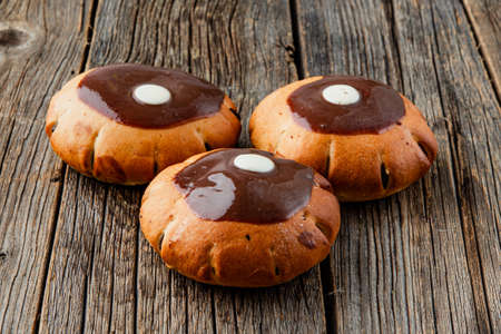 Sweet Soft puff pastry bun with custard, raisins and chocolate Bakery