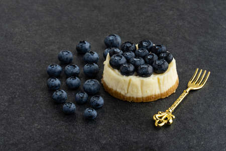 Blueberry cheesecake on stone backgroundの写真素材