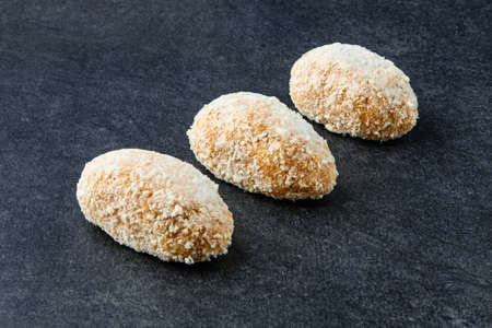 Frozen Chicken Cutlet on Stone Background. Frozen Semi-finished Productsの写真素材