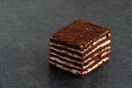 chocolate vanilla cake on gray stoneの写真素材
