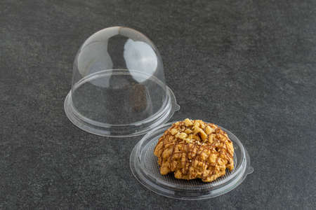 Slice of nut cake on dark backgroundの写真素材