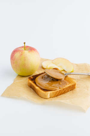 toast with cheese curd, honey and red apple, snack, clean eatingの写真素材