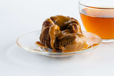 breakfast with chocolate brownie, caramel and tea cupの写真素材