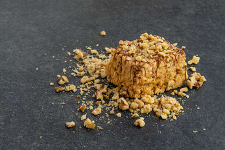 Slice of nut cake on dark backgroundの写真素材