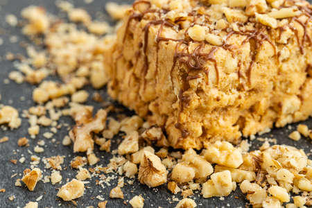 Slice of nut cake on dark backgroundの写真素材
