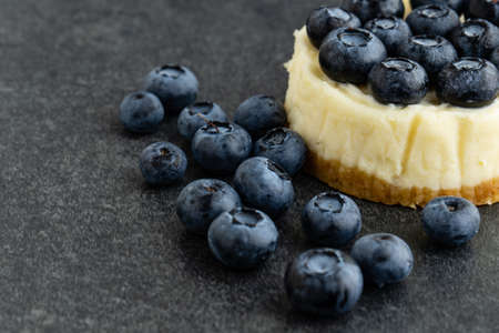 Close-up view of Blueberry cheesecake on stone backgroundの写真素材