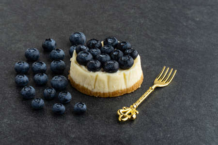 Blueberry cheesecake on stone backgroundの写真素材
