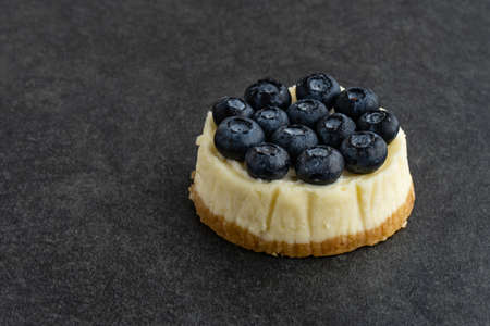 Blueberry cheesecake on stone backgroundの写真素材