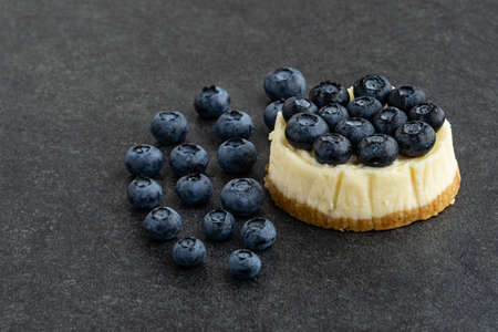 Blueberry cheesecake on stone backgroundの写真素材