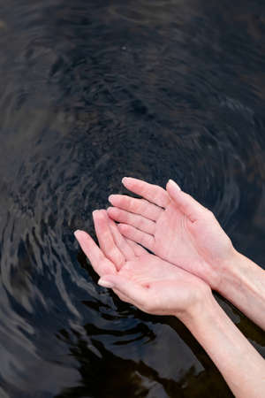 girl touch water, closeup viewの写真素材