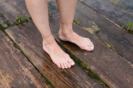 Feet immersed in the clear water, Feet in water. Selfie of legs and barefoot. vacation at summer holidayの写真素材