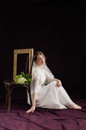 Bride in white deress taking a frame in front of their facesの写真素材