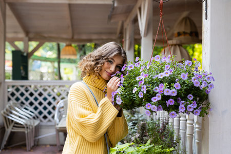 Girl in cafe outdoor. Lifestyle with seasonal disease.の写真素材