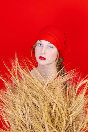 Beautiful Fashion art portrait of young sexy blonde woman with wheat. Organic cosmetic products for healthy hair conceptの写真素材