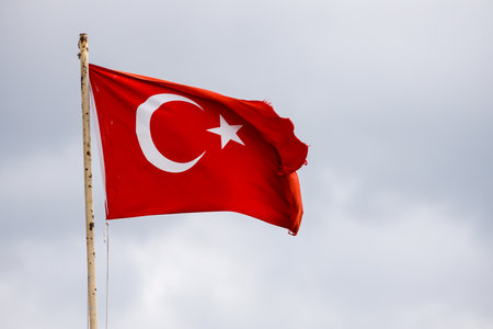 Turkish flag - against gray skyの写真素材