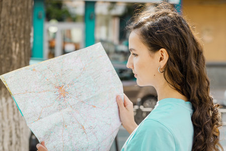 girl holding map, tourist searching way, travelling, standing over white background
