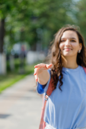 Girl extends a hand to meetの写真素材