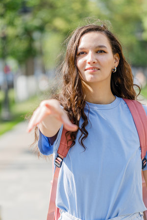 Girl extends a hand to meetの写真素材