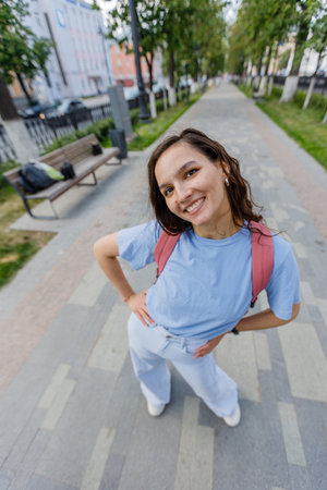 Portrait of a beautiful brunette girl outdoors on city streetの写真素材