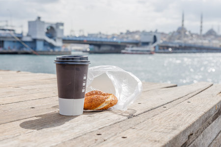 Morning in Istanbul, coffee to go and simit on the shores of the Bosphorusの写真素材