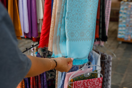 woman buying a scarf at an oriental bazaarの写真素材