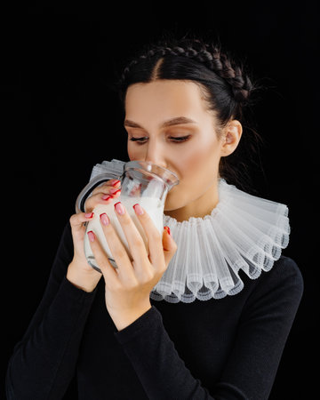 Young woman is drinking milk. Fashion Healthy nutritionの写真素材
