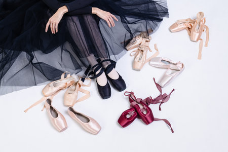 Ballerina's legs on pointe shoes close-up. achieving success in modern ballet