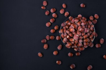 Hazelnut isolated on black background. Set or collection. Stack of hazelnuts. Hazelnut backgroundの写真素材