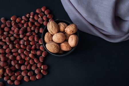 Hazelnut isolated on black background. Set or collection. Stack of hazelnuts. Hazelnut backgroundの写真素材