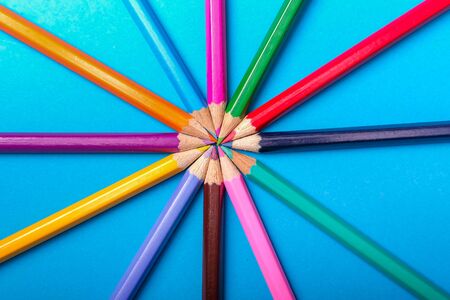 Color pencils of various color on a blue backgroundの写真素材