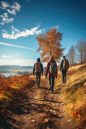 Nature's Retreat: Friends Share Joyful Moments Hiking amidst Autumn Leaves, Surrounded by the Splendor of a Clear Blue Sky. Generative AIの素材