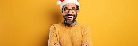happy indian man in santa hat and glasses on yellow backgroundの素材