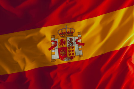 Spain waving flag. Closeup of Spain waving flag. Perfect for background or texture purposes.の素材