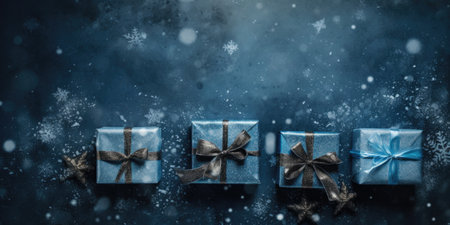 Blue gift boxes on blue background with snowflakes. Christmas and New Year concept.の素材