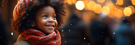 beautiful african american woman in scarf on christmas streetの素材