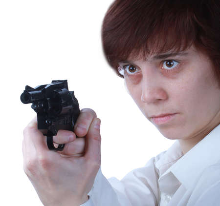 Professional woman who is holding a gun pointing it at a target on a white backgroundの写真素材